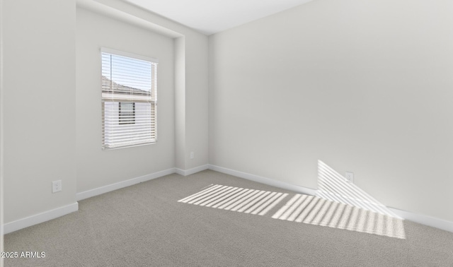 empty room featuring light colored carpet