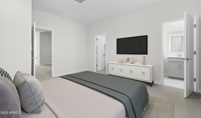 bedroom with light carpet, sink, and ensuite bath