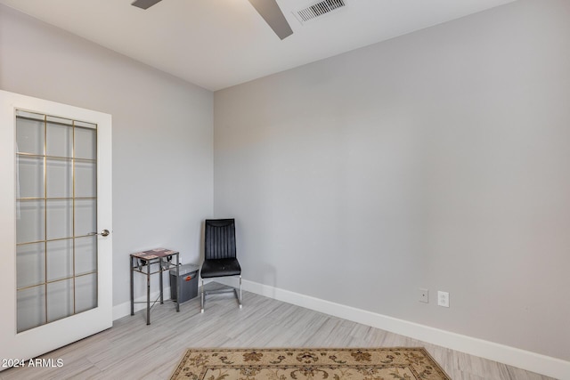 sitting room featuring light hardwood / wood-style floors