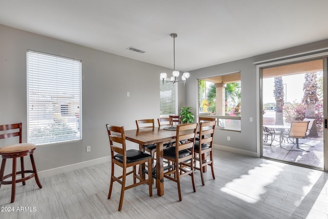 dining space featuring a notable chandelier