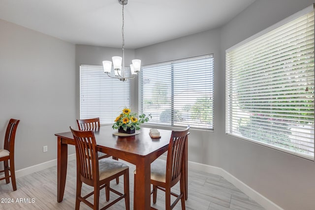 dining space with a chandelier