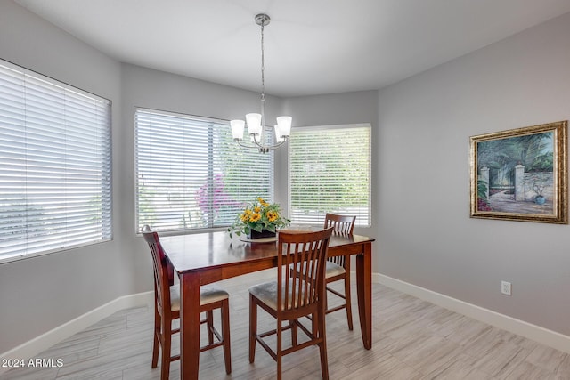 dining space featuring an inviting chandelier