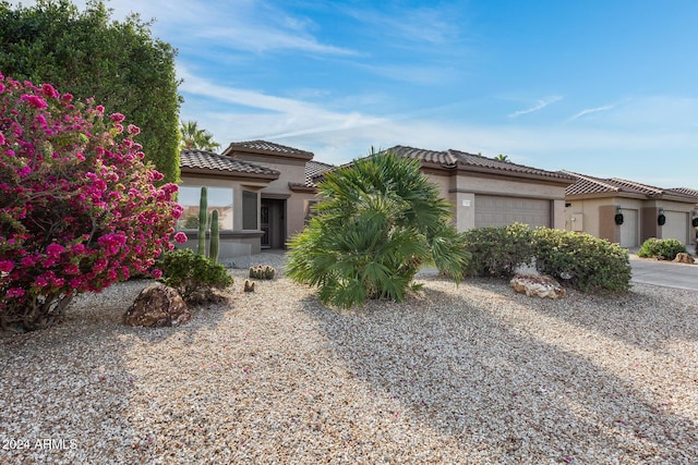 mediterranean / spanish-style house featuring a garage