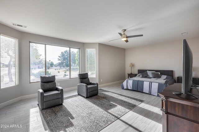 bedroom featuring ceiling fan and light hardwood / wood-style flooring