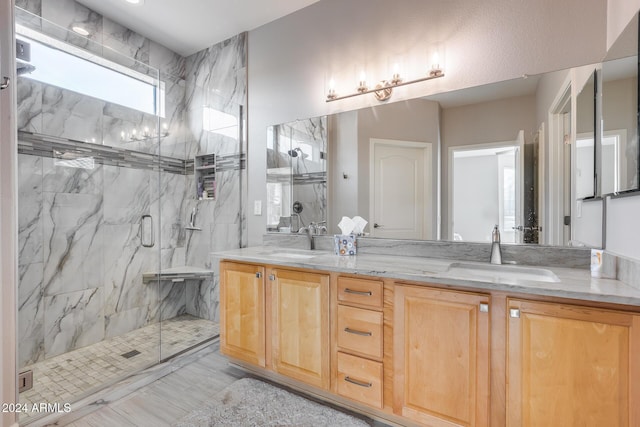 bathroom featuring vanity and an enclosed shower