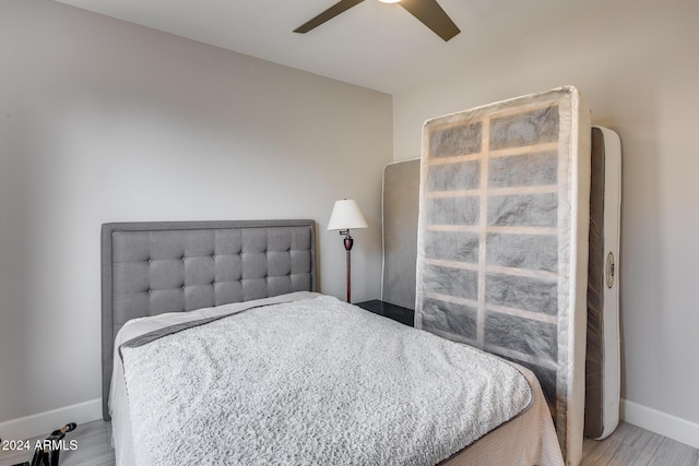 bedroom featuring ceiling fan and light hardwood / wood-style floors