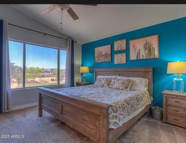 bedroom featuring ceiling fan, light colored carpet, and vaulted ceiling