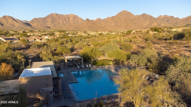 view of swimming pool with a gazebo, a mountain view, a patio, and fence