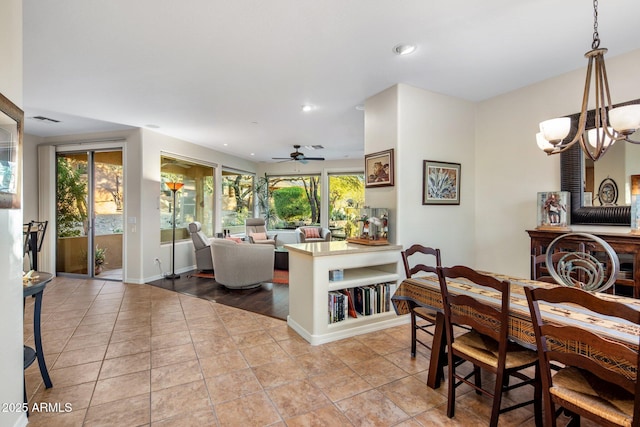 tiled dining room with recessed lighting, visible vents, baseboards, and ceiling fan with notable chandelier