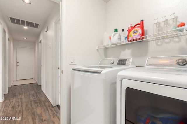 laundry area featuring visible vents, independent washer and dryer, wood finished floors, recessed lighting, and laundry area