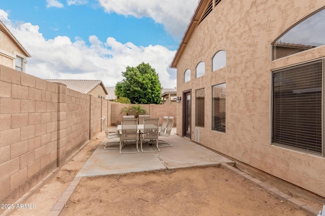 view of patio / terrace featuring outdoor dining area and a fenced backyard