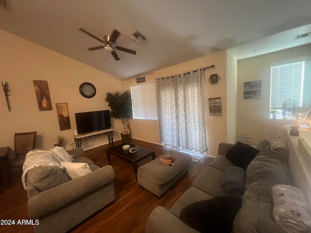 living room featuring ceiling fan, plenty of natural light, and dark hardwood / wood-style flooring