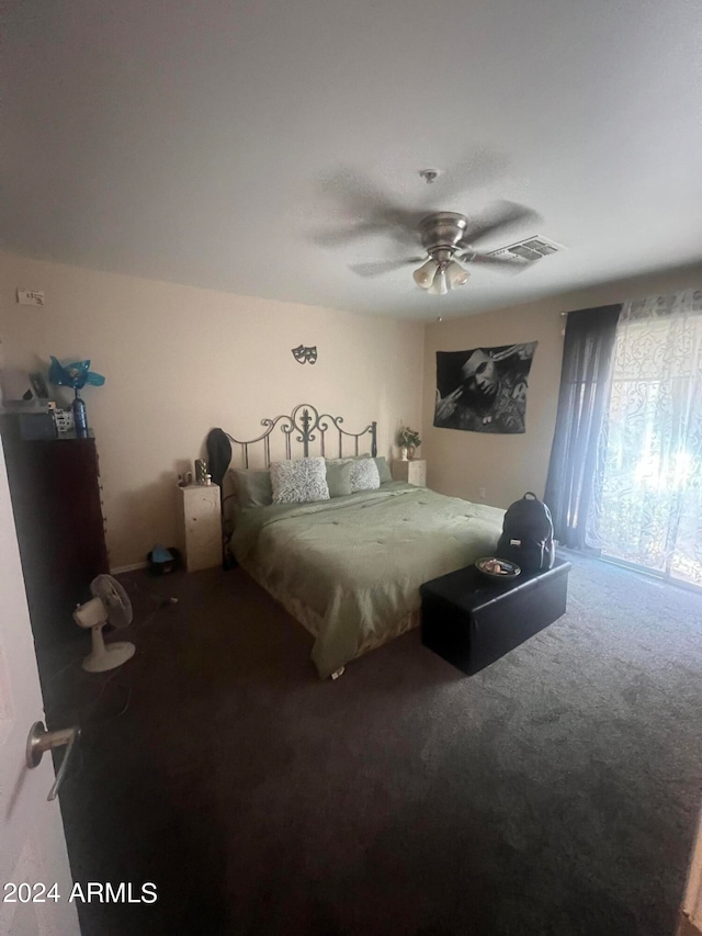 bedroom with ceiling fan and carpet