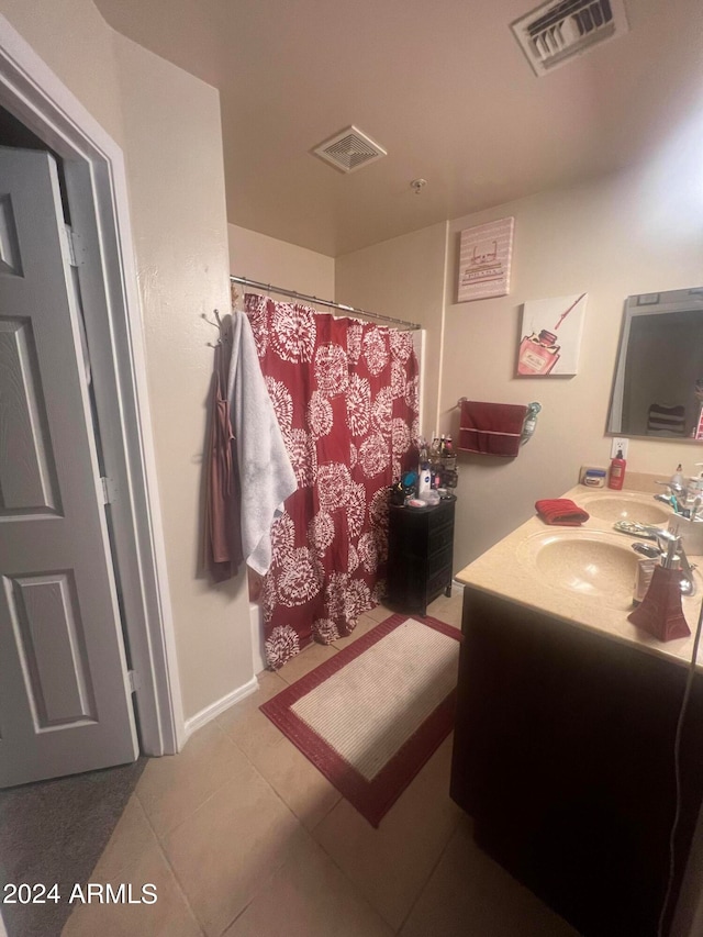 bathroom with vanity and tile patterned floors