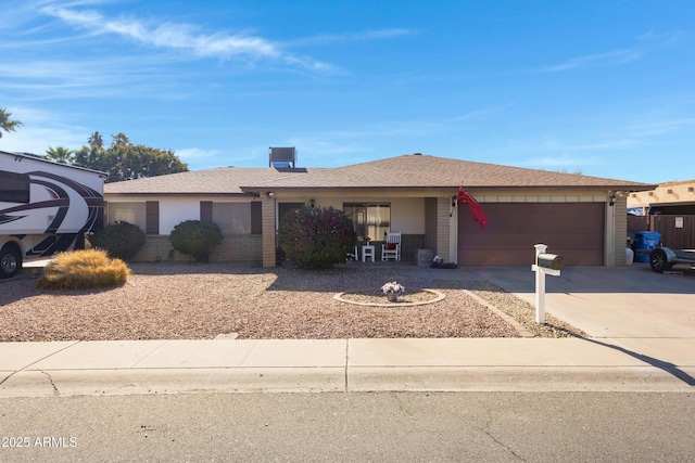 single story home with a garage and central AC