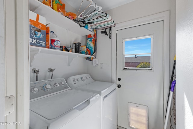 laundry area featuring washing machine and clothes dryer