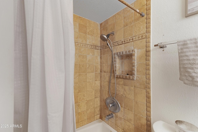 bathroom featuring shower / bath combination with curtain and toilet