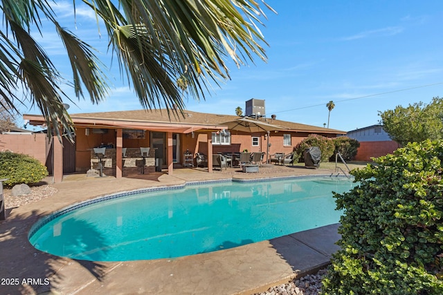 view of swimming pool featuring a patio