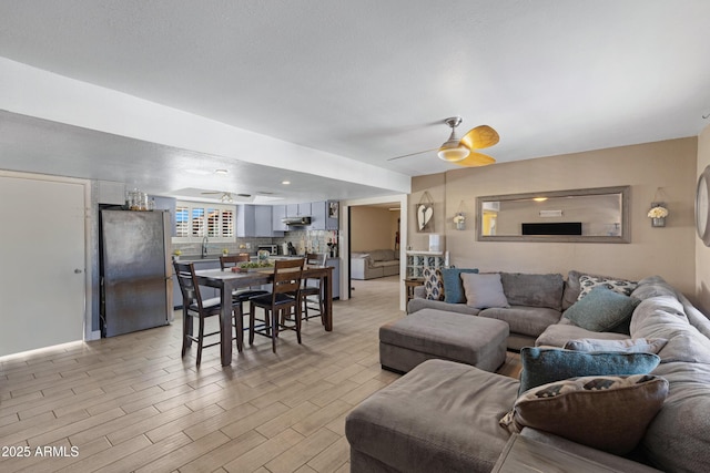 living room featuring ceiling fan