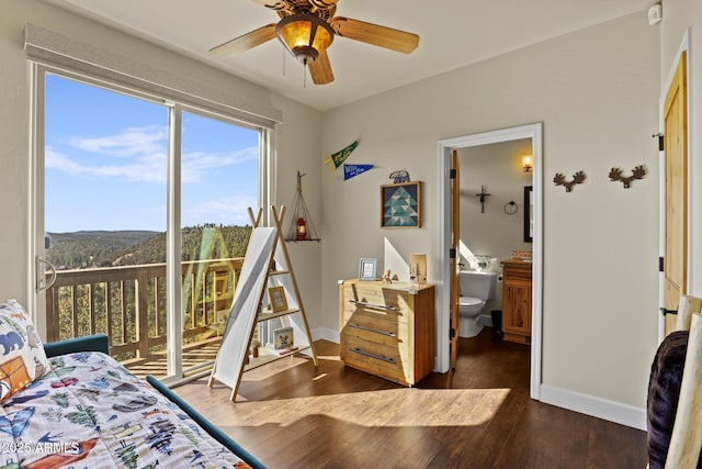 bedroom featuring ensuite bathroom, ceiling fan, access to exterior, and dark hardwood / wood-style flooring