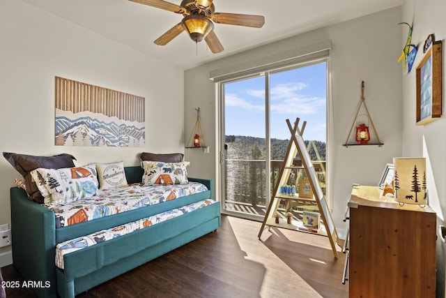 bedroom featuring ceiling fan, access to exterior, and dark hardwood / wood-style flooring