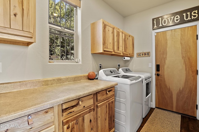 laundry room with cabinets and washing machine and dryer