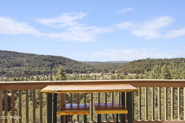 wooden terrace featuring a mountain view