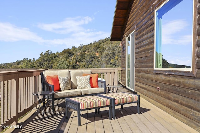 wooden deck featuring an outdoor living space