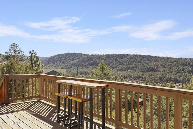 wooden deck featuring a mountain view