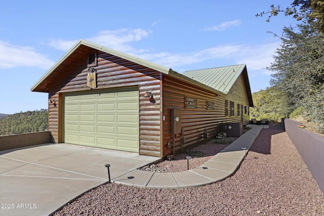 exterior space featuring an outbuilding and a garage