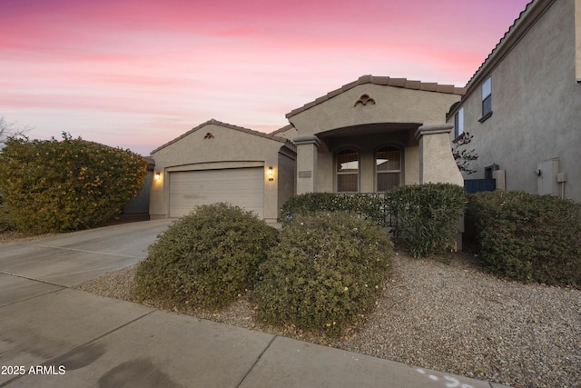 view of front of property with a garage