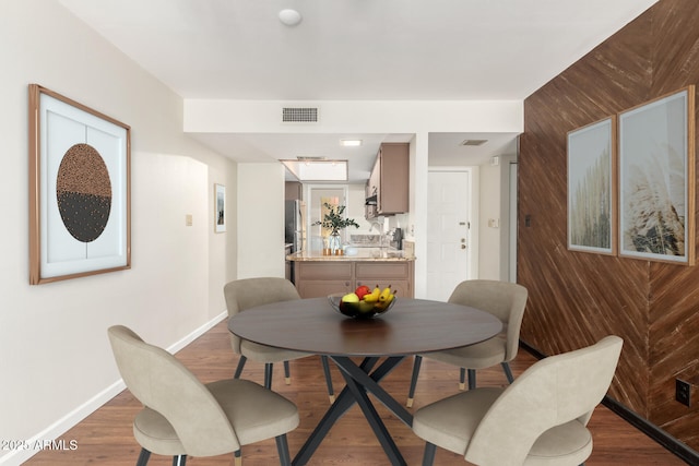 5208 S Deborah Dr, Tempe, AZ 85283 - dining area featuring baseboards, visible vents, and wood finished floors