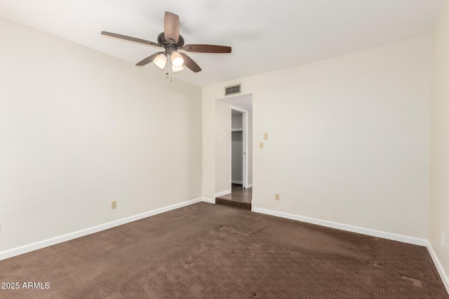5208 S Deborah Dr, Tempe, AZ 85283 - spare room with baseboards, ceiling fan, dark colored carpet, and visible vents