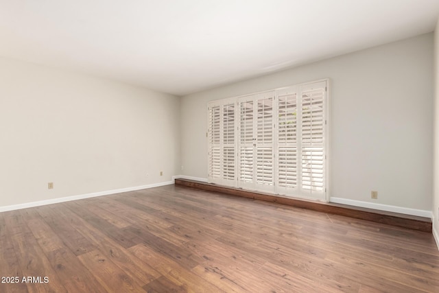 5208 S Deborah Dr, Tempe, AZ 85283 - unfurnished room featuring baseboards and wood finished floors