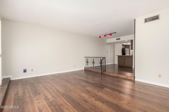 5208 S Deborah Dr, Tempe, AZ 85283 - unfurnished room with baseboards, visible vents, and wood finished floors