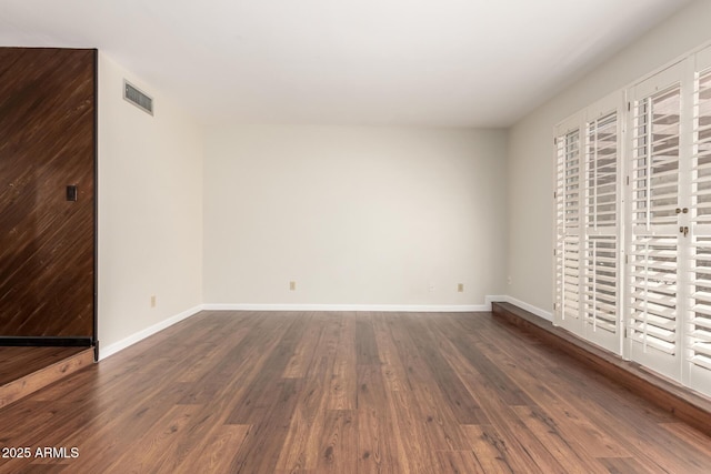 5208 S Deborah Dr, Tempe, AZ 85283 - spare room with baseboards, visible vents, and dark wood finished floors
