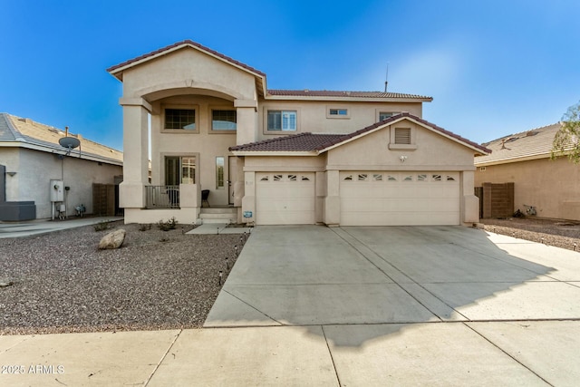 view of front of home with a garage and central air condition unit