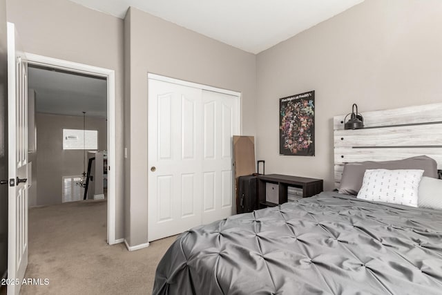 carpeted bedroom featuring a closet