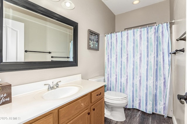 bathroom featuring hardwood / wood-style flooring, vanity, and toilet