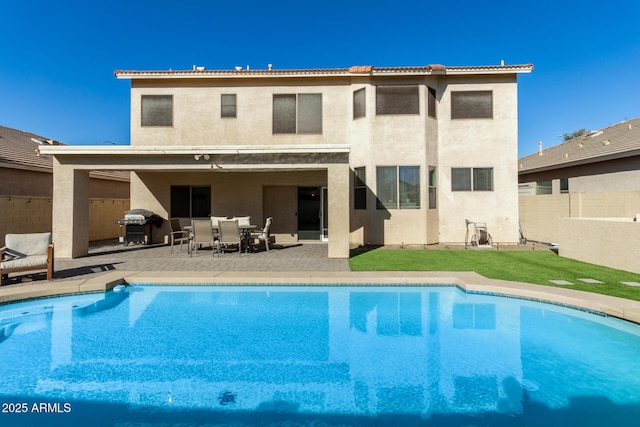 back of house with a patio area