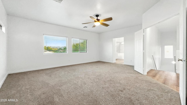6537 W Pioneer St, Phoenix, AZ 85043 - unfurnished bedroom with carpet flooring, ensuite bathroom, and ceiling fan