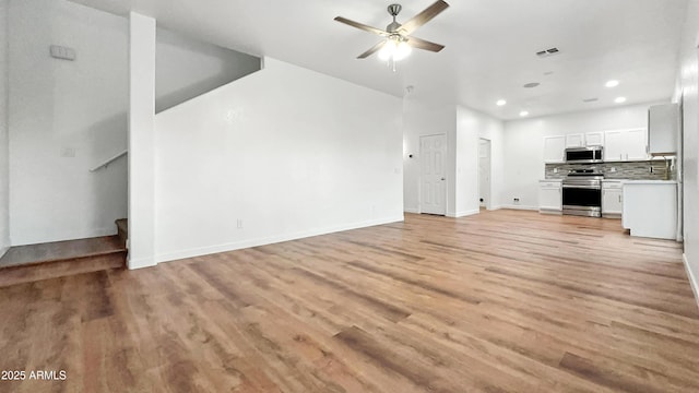 6537 W Pioneer St, Phoenix, AZ 85043 - unfurnished living room featuring recessed lighting, a ceiling fan, and light wood-style flooring