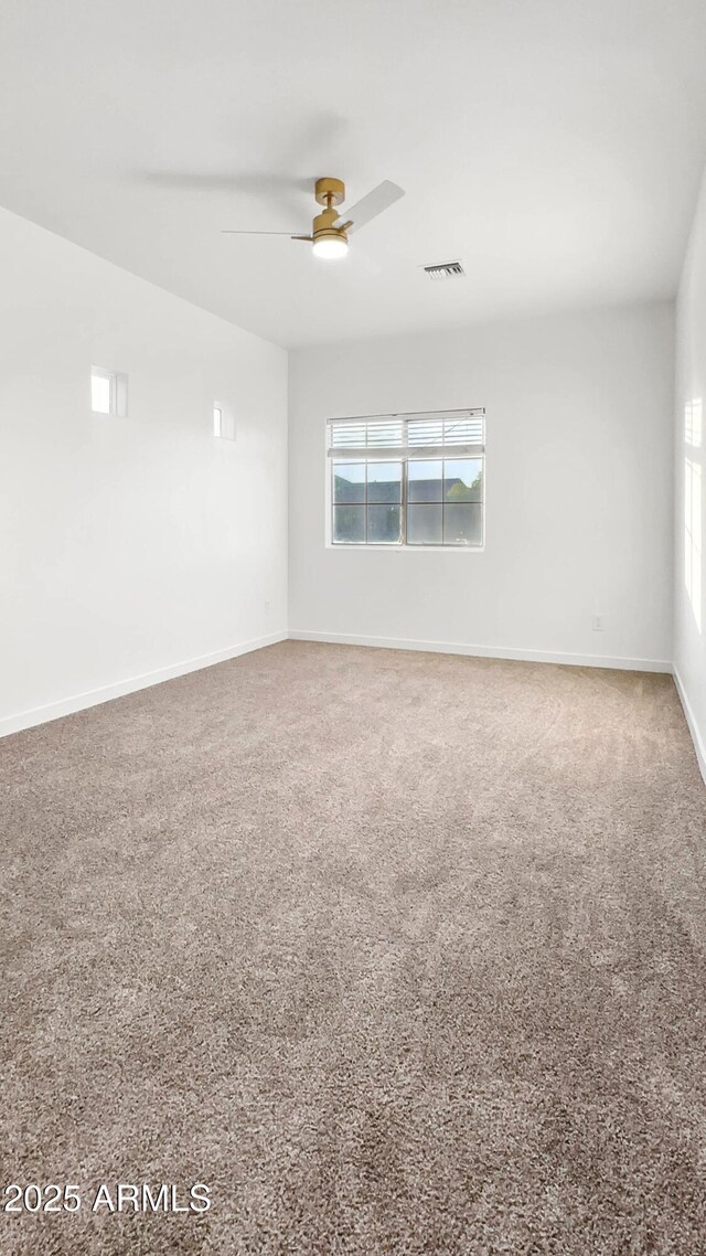 6537 W Pioneer St, Phoenix, AZ 85043 - spare room featuring plenty of natural light, ceiling fan, and carpet