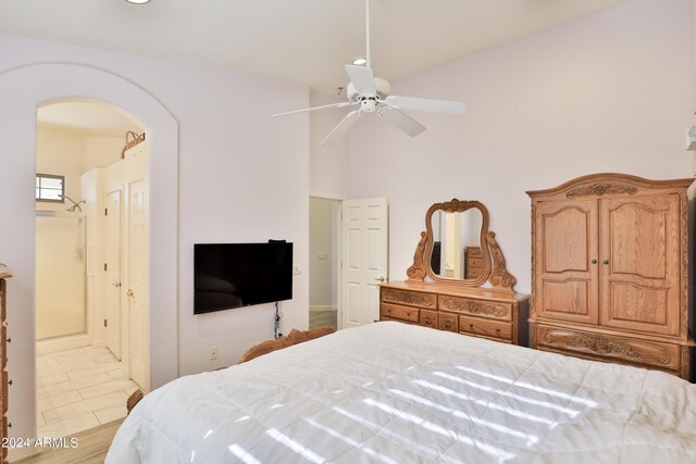 bedroom with lofted ceiling and ceiling fan