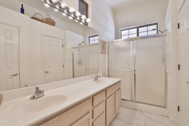 bathroom with vanity and an enclosed shower