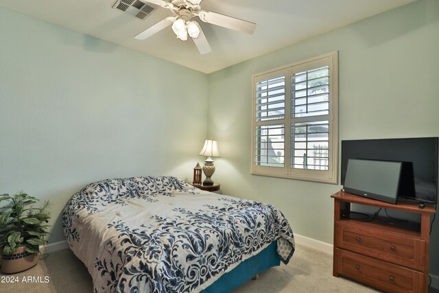 bedroom with ceiling fan and carpet flooring