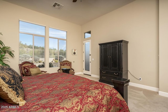 bedroom featuring light carpet and ceiling fan