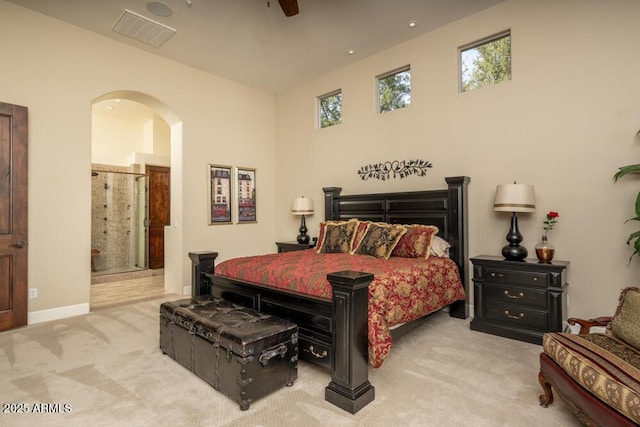 carpeted bedroom featuring ceiling fan and connected bathroom