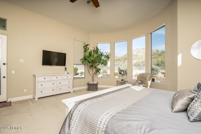 bedroom with light colored carpet and ceiling fan