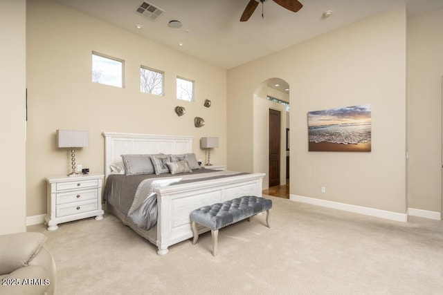 bedroom with ceiling fan and light carpet